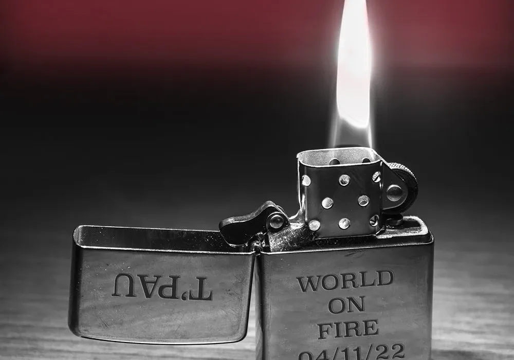 A close up of a lighter with a lit flame